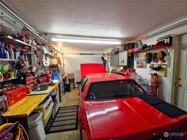 garage with a workshop area