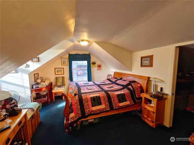 carpeted bedroom with vaulted ceiling