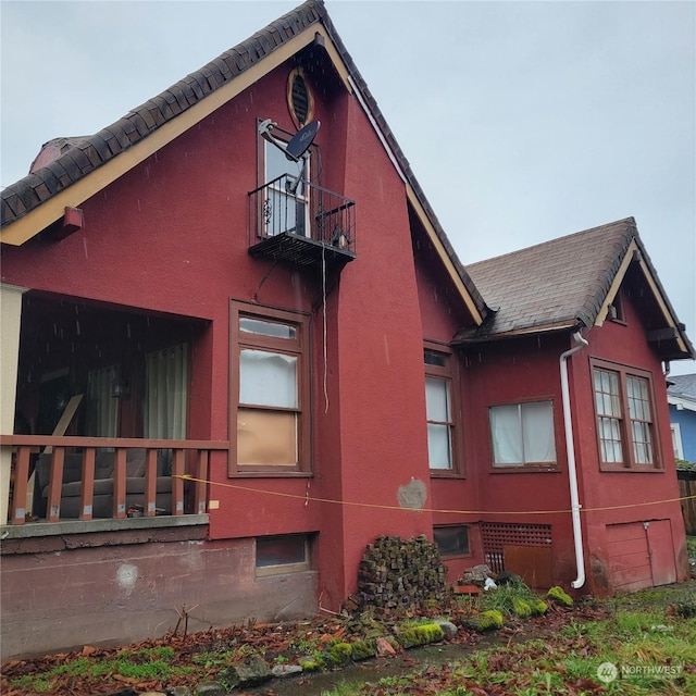 view of home's exterior featuring a balcony