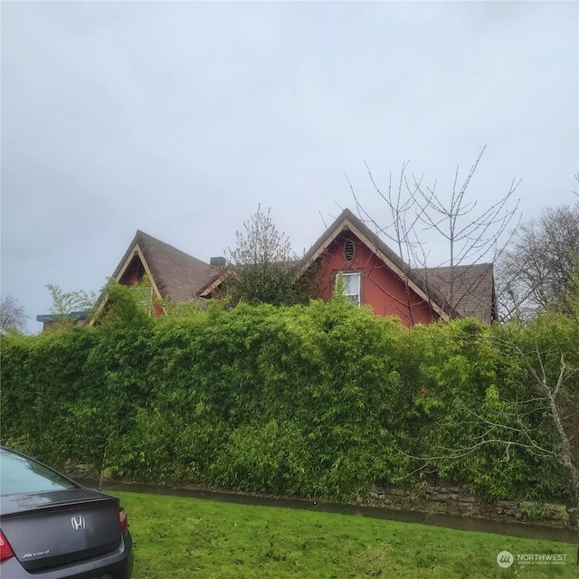 view of home's exterior featuring a yard