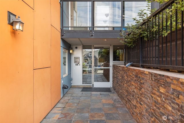 entrance to property featuring a balcony