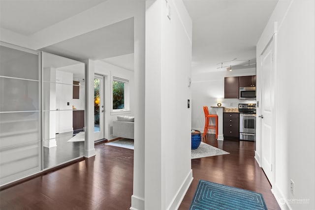 hallway featuring dark hardwood / wood-style flooring