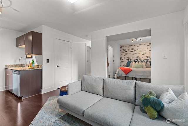 living room featuring dark hardwood / wood-style floors and sink