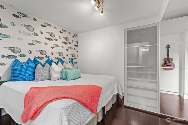 bedroom with wood-type flooring