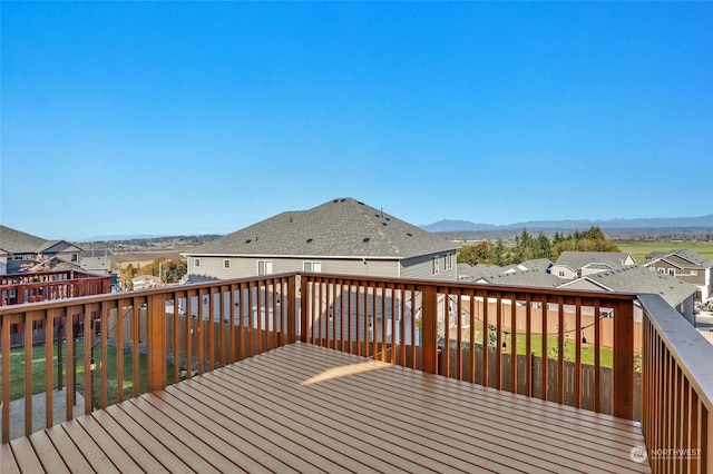 wooden terrace with a mountain view