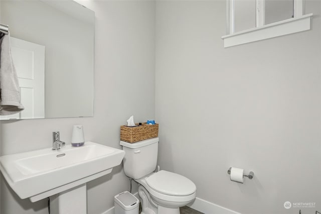 bathroom with sink and toilet