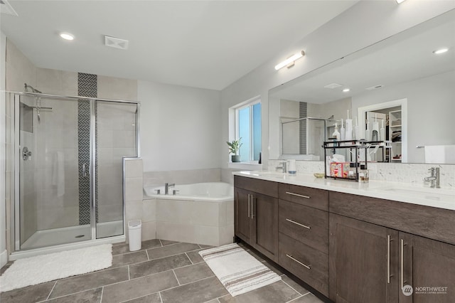 bathroom featuring tile patterned flooring, vanity, and independent shower and bath