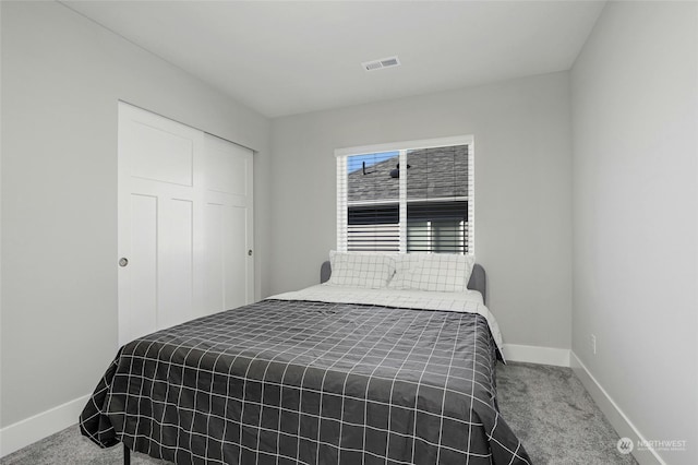 bedroom featuring a closet and carpet floors