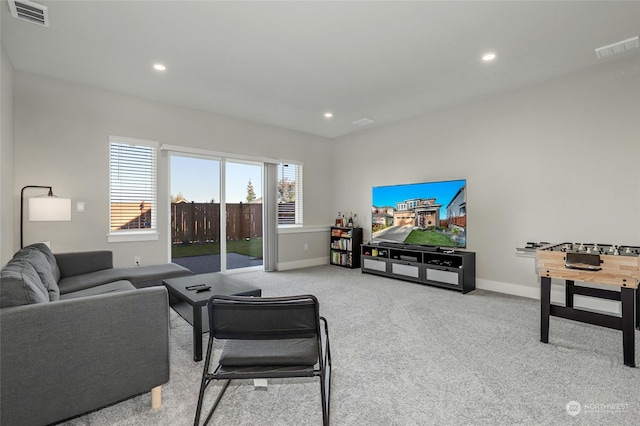 living room featuring light carpet