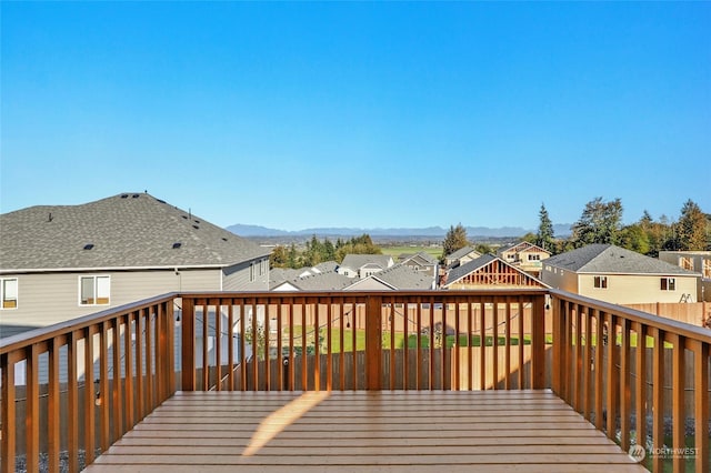 wooden deck with a mountain view