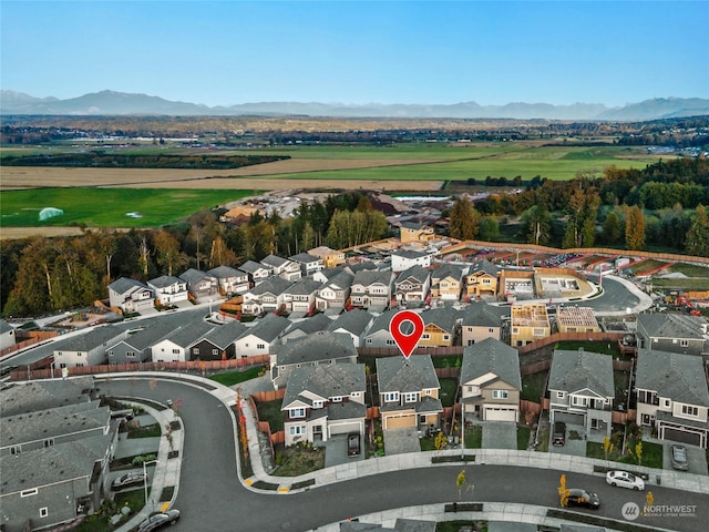 birds eye view of property featuring a mountain view