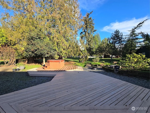 deck featuring a hot tub