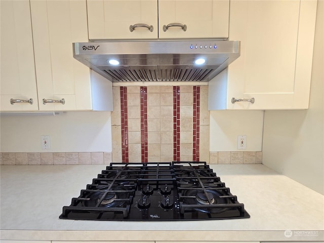 details with exhaust hood and gas stovetop