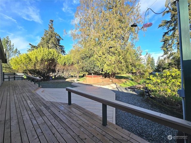 deck with a hot tub