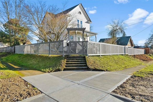 view of front of property featuring a deck