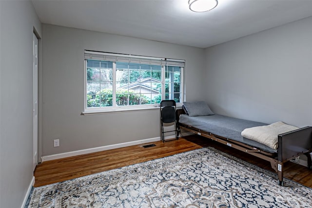 bedroom featuring hardwood / wood-style flooring