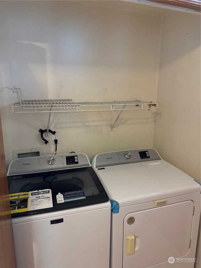 laundry room featuring washing machine and clothes dryer