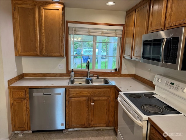 kitchen featuring stainless steel appliances and sink