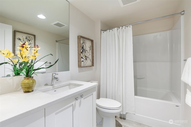 full bathroom with shower / bath combo with shower curtain, vanity, and toilet