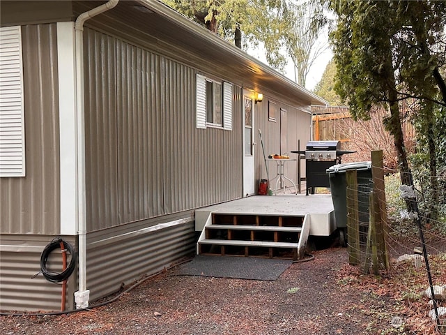 view of property exterior with a deck