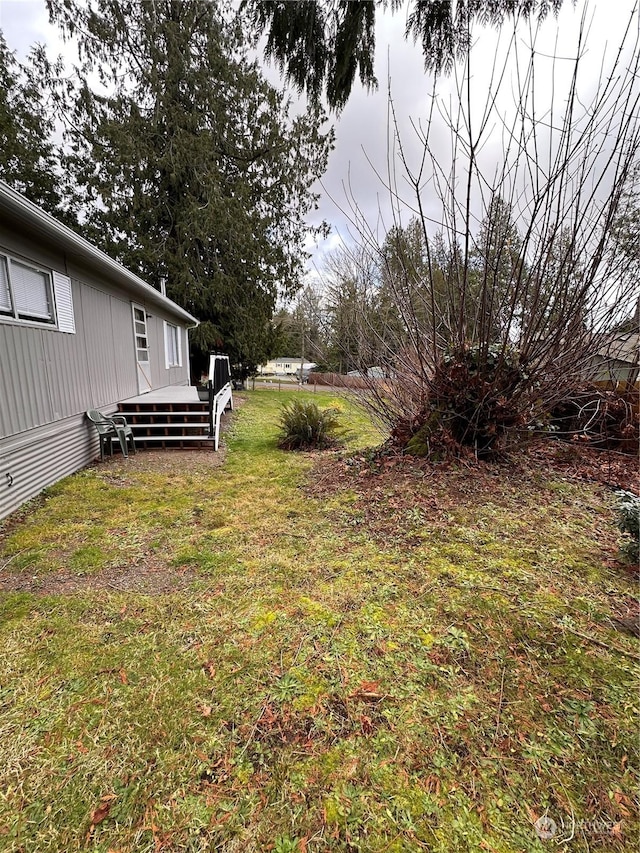 view of yard featuring a wooden deck