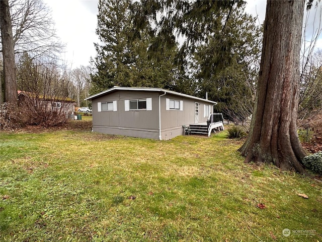 exterior space with a yard and a wooden deck