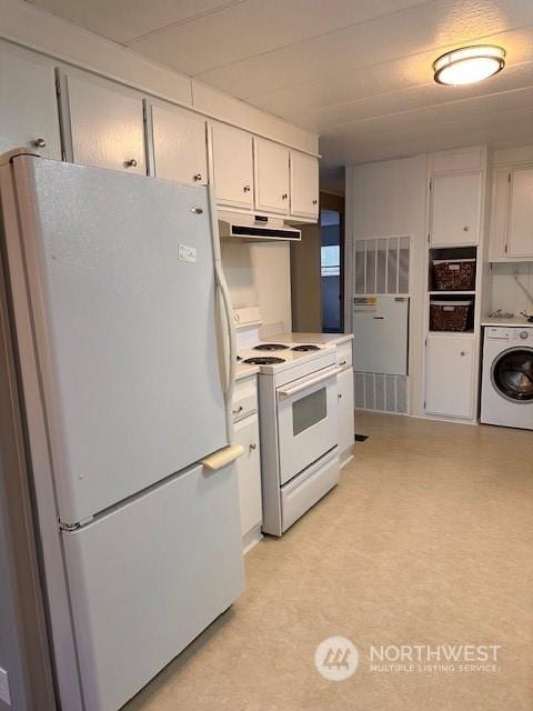 kitchen featuring white cabinets, white appliances, and washer / dryer