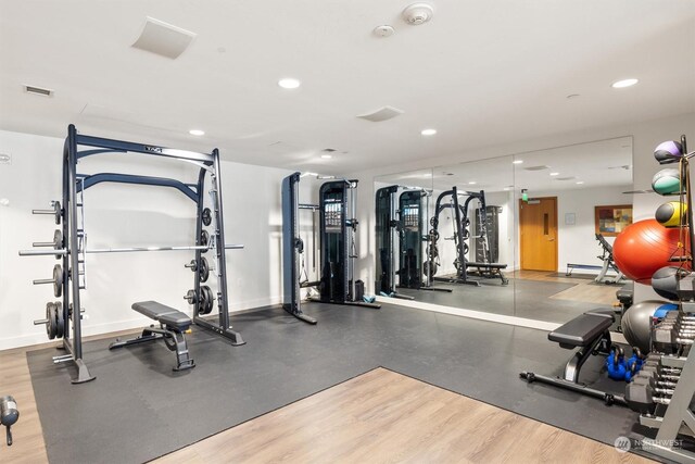 gym with hardwood / wood-style floors