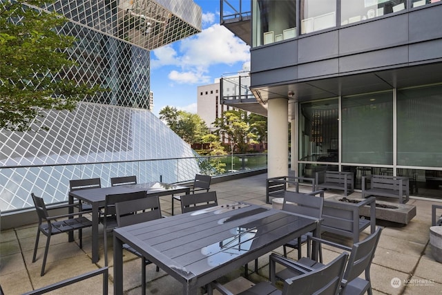 view of patio / terrace with an outdoor fire pit