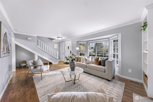 living room featuring ornamental molding and wood-type flooring