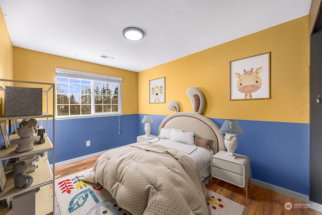 bedroom featuring hardwood / wood-style flooring