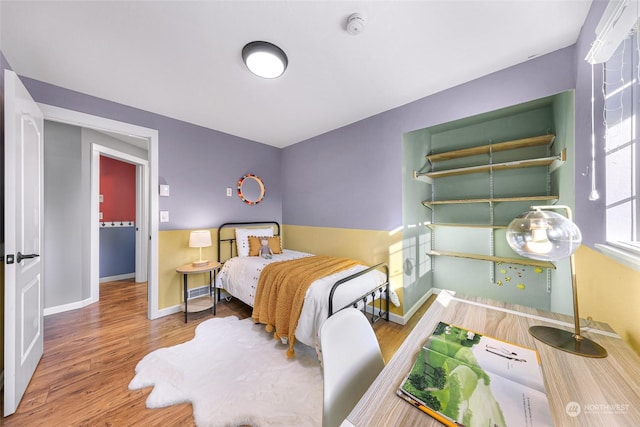 bedroom featuring hardwood / wood-style flooring