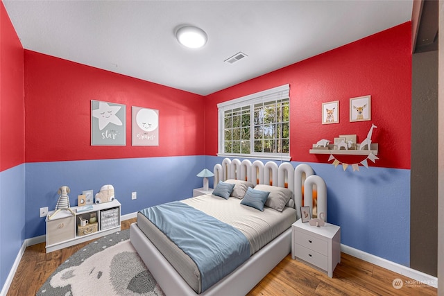 bedroom featuring hardwood / wood-style flooring