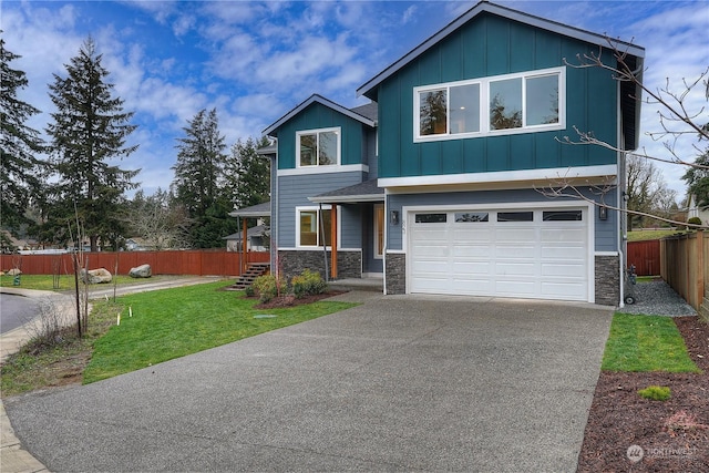 view of front of home featuring a front lawn and a garage