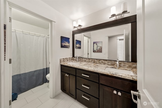 bathroom featuring backsplash, tile patterned floors, toilet, vanity, and a shower with shower curtain