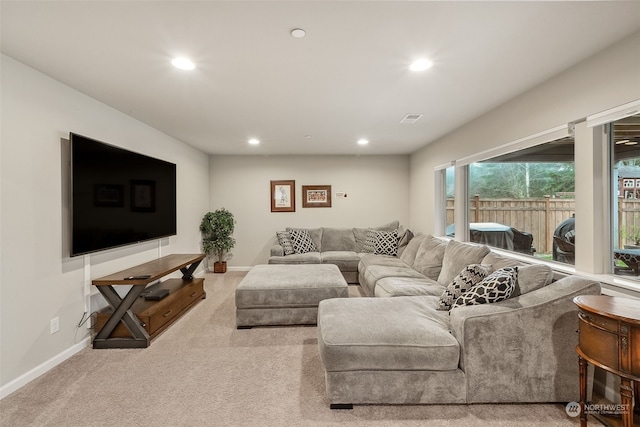 living room featuring light carpet