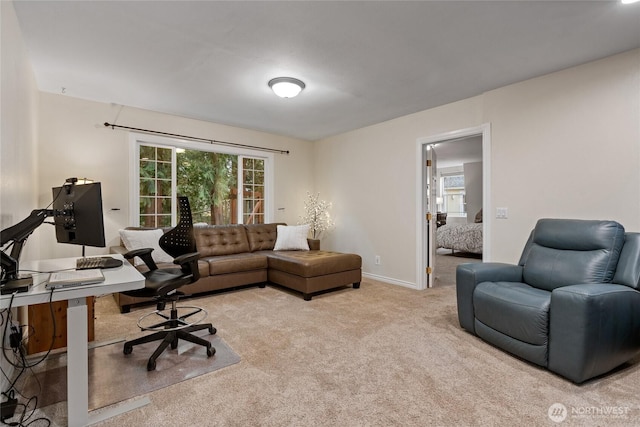 office space with carpet and baseboards