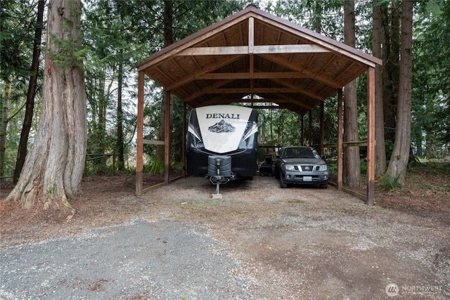 view of vehicle parking featuring a carport and driveway