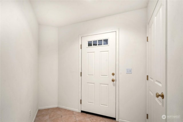 foyer featuring light tile patterned floors