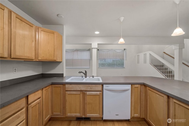 kitchen with light brown cabinetry, white dishwasher, sink, light hardwood / wood-style flooring, and hanging light fixtures