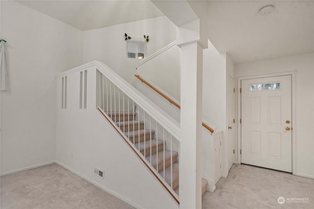 stairs featuring carpet floors