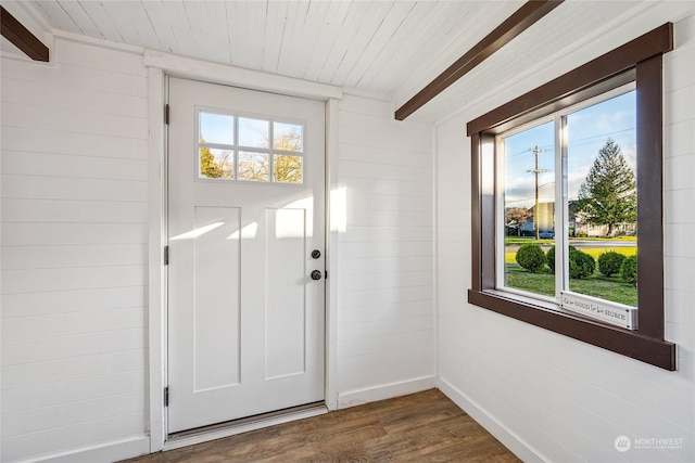 entryway featuring beam ceiling, dark hardwood / wood-style flooring, and wood ceiling