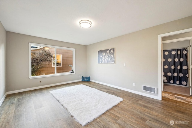 spare room featuring hardwood / wood-style floors