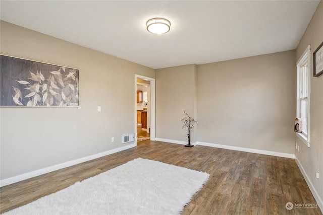 empty room with wood-type flooring