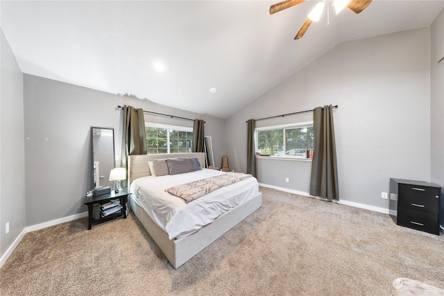 carpeted bedroom featuring vaulted ceiling and ceiling fan