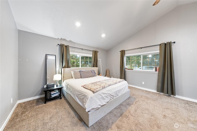 carpeted bedroom with vaulted ceiling