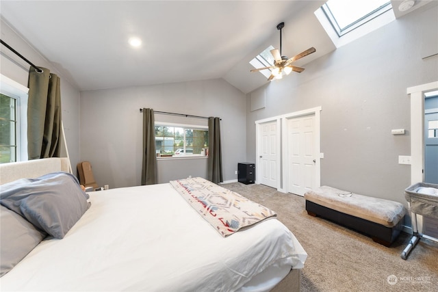 bedroom featuring ceiling fan, carpet floors, and vaulted ceiling