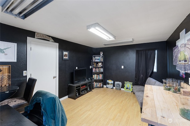 home office with wood-type flooring