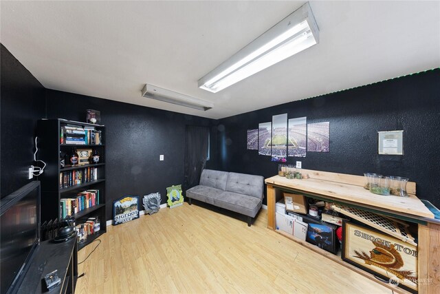 living area with wood-type flooring