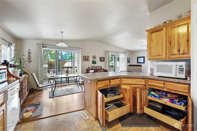 kitchen with kitchen peninsula, white appliances, decorative light fixtures, and lofted ceiling